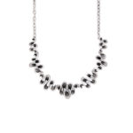 Undulating collar necklace.